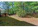 View of a private backyard with mature trees and space for outdoor activities at 1310 Country Club Dr, Durham, NC 27712