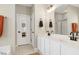 Bright bathroom with a double sink vanity, modern fixtures, and a separate tub at 1310 Country Club Dr, Durham, NC 27712
