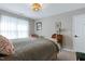 Bedroom featuring a bed, side table, desk, and natural light at 1310 Country Club Dr, Durham, NC 27712