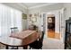 Bright dining room with a wooden table, seating for four, and a large window at 1310 Country Club Dr, Durham, NC 27712