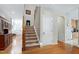 Welcoming entryway with hardwood floors and stairway access to upper level at 1310 Country Club Dr, Durham, NC 27712