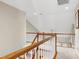 Bright hallway features natural light, wood railing, and neutral carpet at 1310 Country Club Dr, Durham, NC 27712