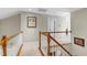 Bright hallway features artwork and wood railing at 1310 Country Club Dr, Durham, NC 27712