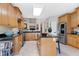 Bright kitchen with granite countertops, stainless steel appliances, and a kitchen island at 1310 Country Club Dr, Durham, NC 27712
