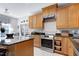 Beautiful kitchen featuring granite countertops, stainless steel appliances and custom cabinets at 1310 Country Club Dr, Durham, NC 27712