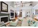 Cozy living room featuring a fireplace, custom shelves and an open floor plan at 1310 Country Club Dr, Durham, NC 27712