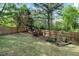 Fenced backyard featuring a garden area with raised beds and arbor at 132 Wheatsbury Dr, Cary, NC 27513