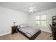 Comfortable bedroom with a cozy bed, side table, and natural light at 132 Wheatsbury Dr, Cary, NC 27513