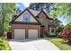 Charming two-story brick home featuring a two-car garage and a well-manicured lawn at 132 Wheatsbury Dr, Cary, NC 27513
