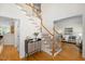 Inviting foyer featuring a staircase with wooden handrails and light hardwood floors at 132 Wheatsbury Dr, Cary, NC 27513
