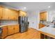 Spacious kitchen boasting stainless steel appliances, plenty of cabinet space, and hardwood floors at 132 Wheatsbury Dr, Cary, NC 27513