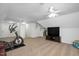 Spacious living room area with fitness equipment and ceiling fans at 132 Wheatsbury Dr, Cary, NC 27513