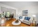 Elegant living area with hardwood floors, a dining area, and comfortable seating at 132 Wheatsbury Dr, Cary, NC 27513