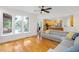 Bright living room with hardwood floors and large windows overlooks the backyard pool at 132 Wheatsbury Dr, Cary, NC 27513
