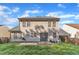 Exterior of the home from the backyard, featuring a lawn, patio, and a wooden fence at 1323 Fairmont St, Durham, NC 27713