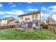 Backyard featuring a spacious lawn, a patio, and a wooden fence at 1323 Fairmont St, Durham, NC 27713