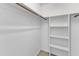 Walk-in closet with shelving and closet rod for organizing clothes at 1323 Fairmont St, Durham, NC 27713