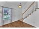 Bright entryway with hardwood floors, stairs to the second floor, and natural light at 1323 Fairmont St, Durham, NC 27713