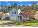 Charming home with grey siding, black shutters, garage, and a beautifully landscaped front yard at 1323 Fairmont St, Durham, NC 27713