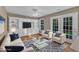 Well decorated living room with sofa, chairs, rug, and built-in entertainment center at 1323 Fairmont St, Durham, NC 27713