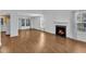 Spacious living room with fireplace, wood floors, and many windows, perfect for entertaining at 1323 Fairmont St, Durham, NC 27713