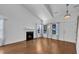 Spacious living room featuring hardwood floors, fireplace, and lots of natural light at 1323 Fairmont St, Durham, NC 27713