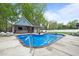Aerial view of a home with a beautiful in-ground swimming pool and pool house at 1325 George Bason Rd, Graham, NC 27253