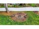 A charming backyard firepit area features two wooden chairs and a white privacy fence at 1325 George Bason Rd, Graham, NC 27253