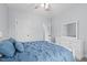 Calming bedroom with blue bedding, a white dresser, and ample natural light at 1325 George Bason Rd, Graham, NC 27253