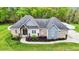 Charming home with brick and siding accents, well-manicured landscaping, and a welcoming entrance at 1325 George Bason Rd, Graham, NC 27253