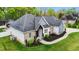 Attractive single-story home with lush landscaping and a brick and light blue siding facade at 1325 George Bason Rd, Graham, NC 27253