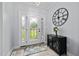 Inviting foyer with patterned glass front door, side-lights, and stylish decor at 1325 George Bason Rd, Graham, NC 27253
