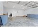 The spacious three car garage has ample storage cabinets and a freshly painted interior at 1325 George Bason Rd, Graham, NC 27253