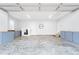 The spacious three car garage has ample storage cabinets and a freshly painted interior at 1325 George Bason Rd, Graham, NC 27253