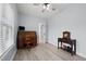 Well-lit home office with wood-look floors, classic furnishings, and neutral paint at 1325 George Bason Rd, Graham, NC 27253