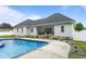 A stunning inground pool with a patio and landscaped surroundings is perfect for outdoor entertaining at 1325 George Bason Rd, Graham, NC 27253