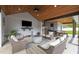 Inviting outdoor living space featuring a kitchen, TV area, and comfortable seating at 1325 George Bason Rd, Graham, NC 27253