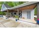 Outdoor pool house featuring an outdoor kitchen, lounge area, and covered patio at 1325 George Bason Rd, Graham, NC 27253
