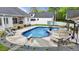 Enjoy a private backyard oasis with a refreshing inground pool and ample space for relaxation and entertainment at 1325 George Bason Rd, Graham, NC 27253