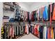 Walk-in closet with ample storage, including shelving, hanging rods, and space for shoes and accessories at 1325 George Bason Rd, Graham, NC 27253