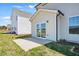 The backyard features a concrete patio with a sliding glass door leading into the home at 135 Carlton Ln, Franklinton, NC 27525