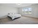 Spacious carpeted bedroom with abundant natural light from three large windows at 135 Carlton Ln, Franklinton, NC 27525