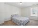Cozy bedroom with blue patterned bedding and ample natural light at 135 Carlton Ln, Franklinton, NC 27525