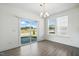 Bright dining area with sliding glass doors providing natural light and backyard access at 135 Carlton Ln, Franklinton, NC 27525