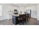 Modern kitchen with island, stainless steel appliances, and a view of the dining area at 135 Carlton Ln, Franklinton, NC 27525