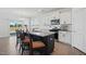 Modern kitchen featuring stainless steel appliances, white cabinets, and a large island at 135 Carlton Ln, Franklinton, NC 27525