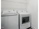 Bright laundry room with a full size washer and dryer at 135 Carlton Ln, Franklinton, NC 27525
