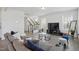 Comfortable living room with neutral tones, staircase, and open view to the rest of the home at 135 Carlton Ln, Franklinton, NC 27525