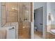 This bathroom features a tiled shower with glass door, with a view of the toilet room to the right at 1422 Gormly Cir, Sanford, NC 27330
