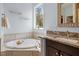 Bathroom with jetted tub, double vanity, granite countertops, and tile flooring at 1422 Gormly Cir, Sanford, NC 27330